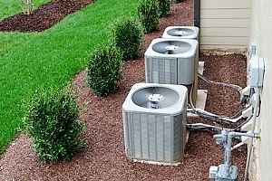 air conditioning units on the side of a home